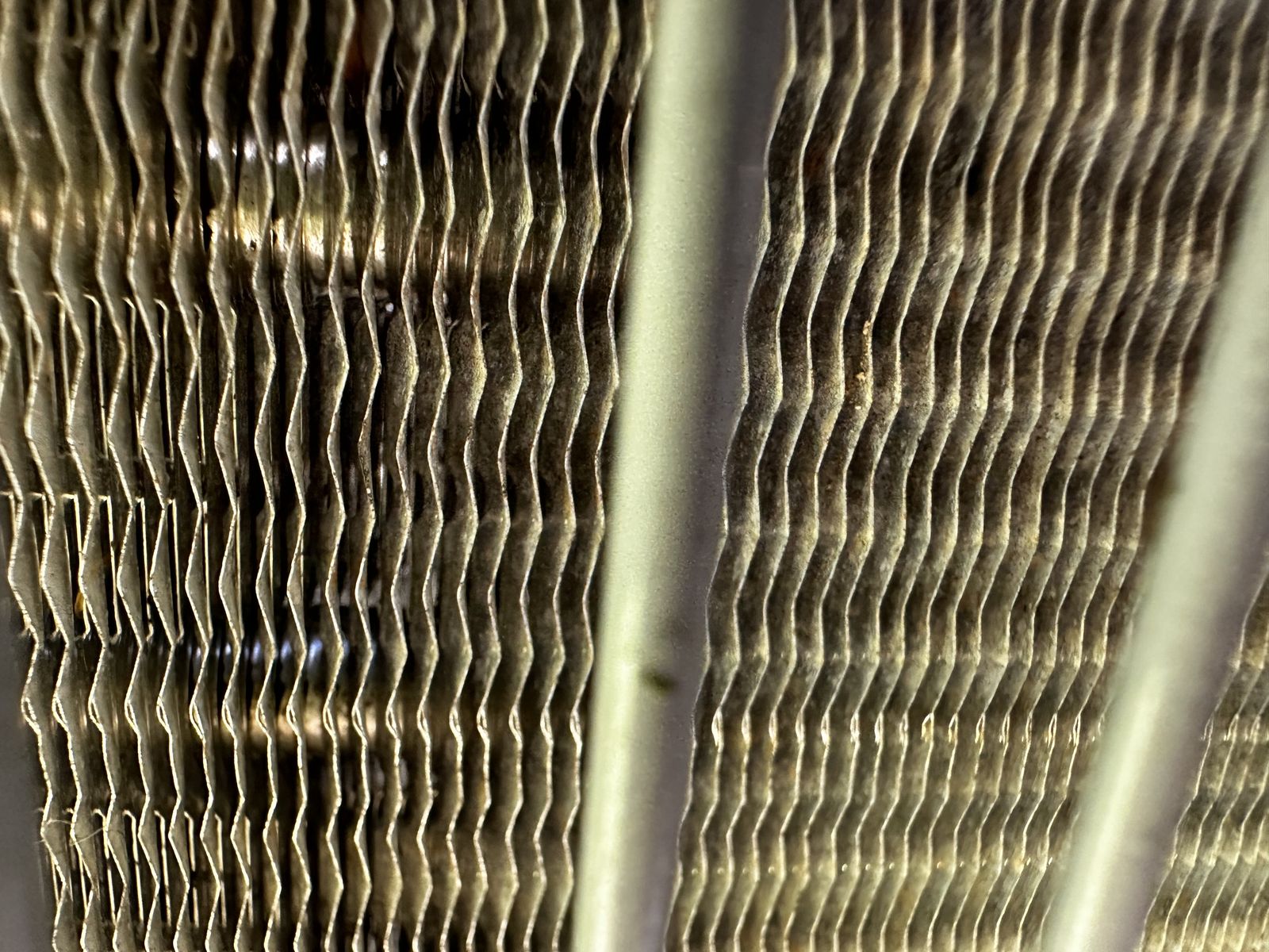 A clean AC condenser coil after a maintenance tune-up